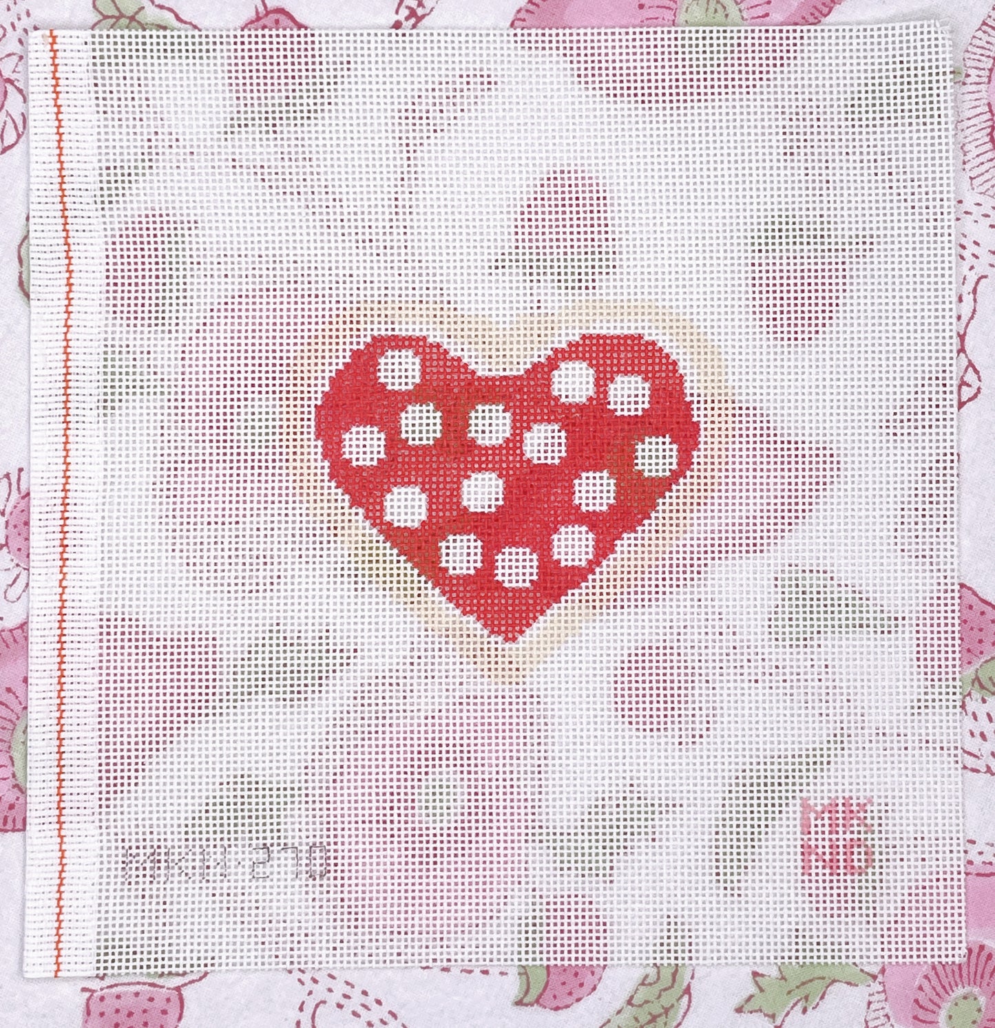 red cookie w/ white dots